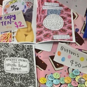 Collage of zines and buttons made by Barnard Zine Club members