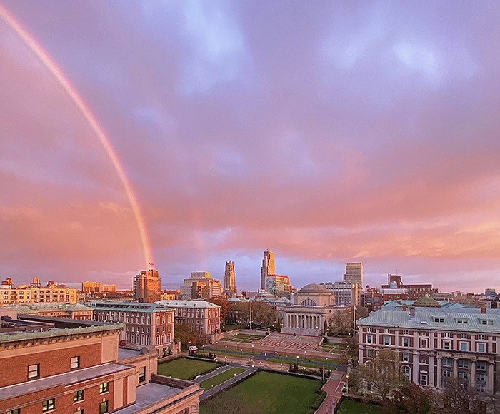 Rainbow over Morningside campus against pink and purple skies. 