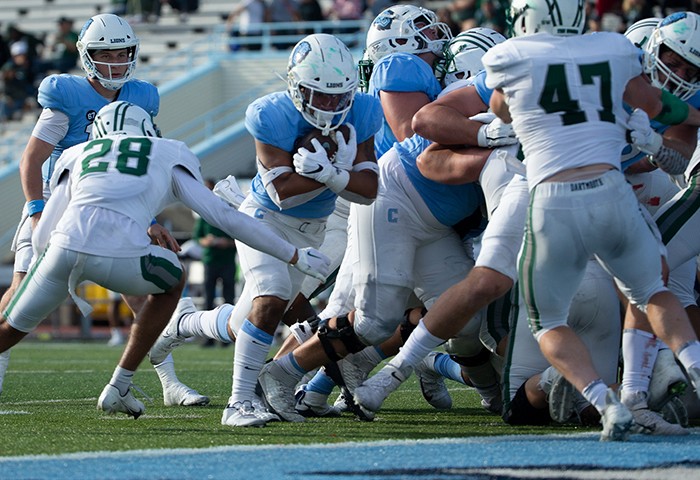 Columbia Lions Football team members fight valiantly on Kraft Field as Ty'son Edwards makes a touchdown. 