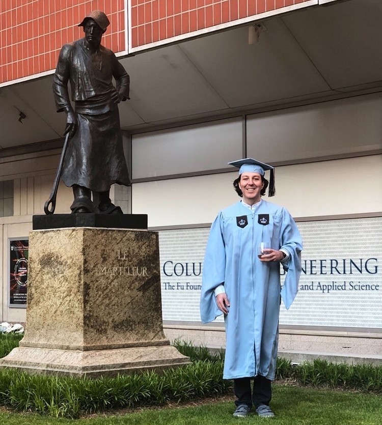 Ari Zingillioglu (SEAS'20)  poses at the Le Marteleur statue on Columbia's campus. 