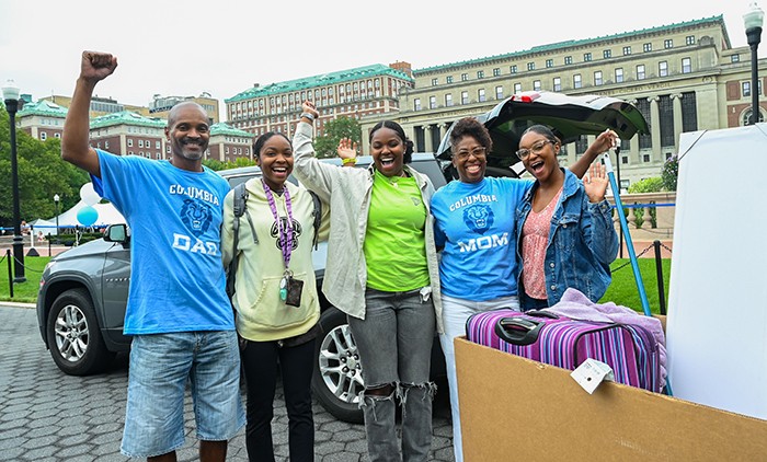 A family with a minivan moves in a Columbia student to their dorm. 