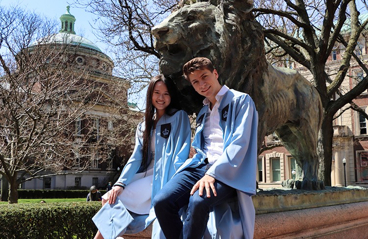 Katherine Liu (SEAS'21) & Michael Grandel (SEAS'21) pose in front of the Scholars Lion statue on Columbia's campus. 