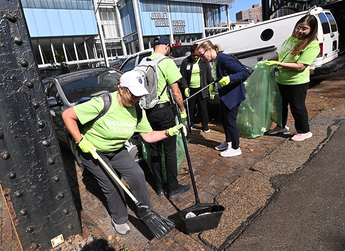 Volunteers helping to clean Broadway in Manhattanville