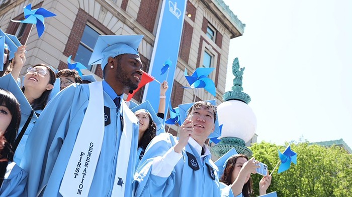 The second class of Columbia Climate School graduates celebrates with characteristic pinwheels. Photo by Sirin Samman.