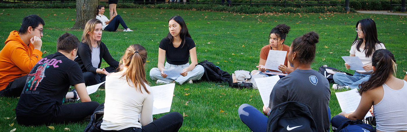 Students discuss homework on Columbia's campus