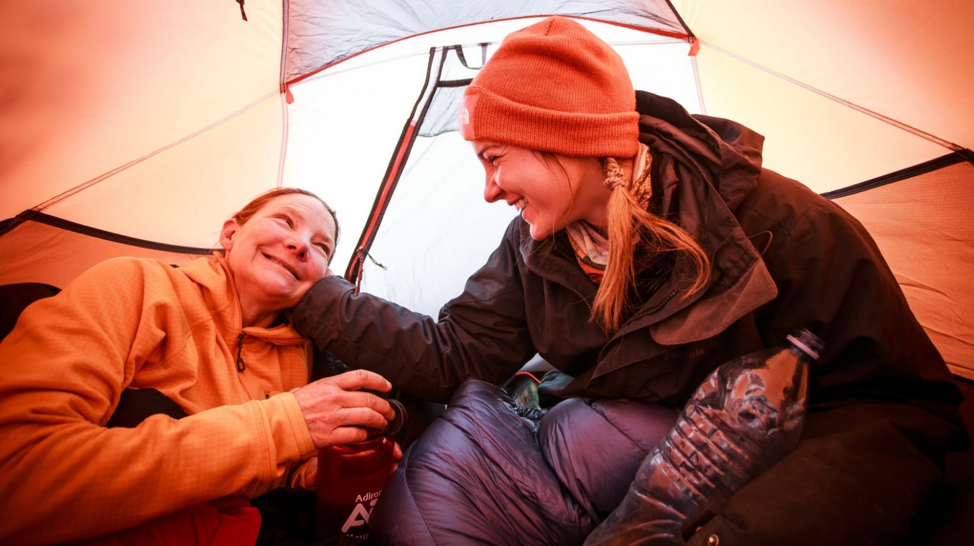 Isabella, left, and Bella shared a moment in their tent at Camp 1 along their climb up Aconcagua. Photo by Max Whittaker for The New York Times
