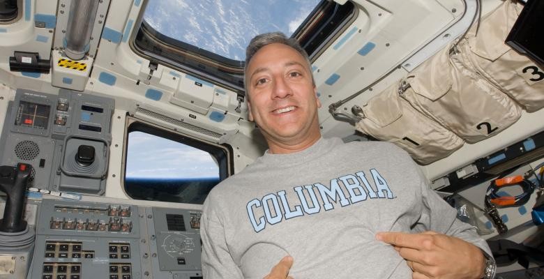 Mike Massimino in a space shuttle