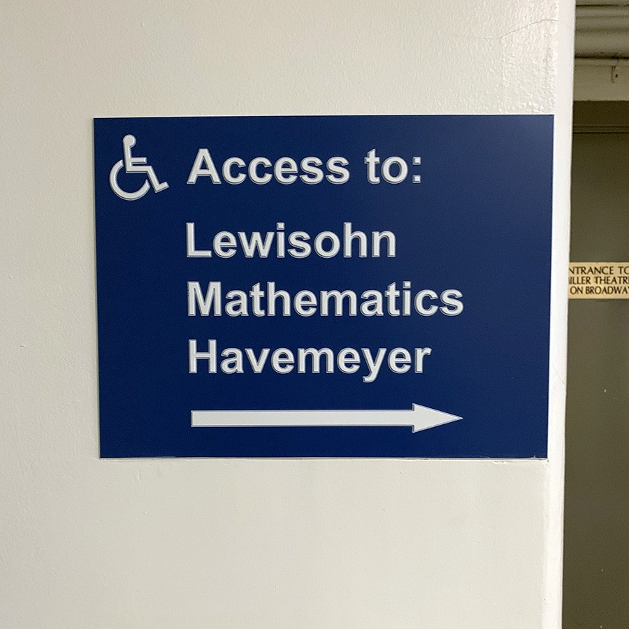 A sign points to disability access ramps to the buildings Lewisohn, Mathematics, and Havemeyer.