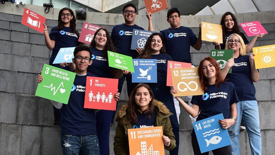 UN Millennium Fellows: A group of students hold signs that highlight various climate change issues
