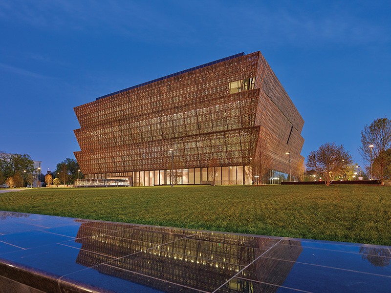 The National Museum of African American History and Culture lit up at night