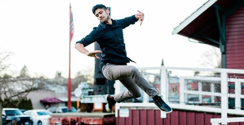 Image of Vikas Arun dancing atop of a building 