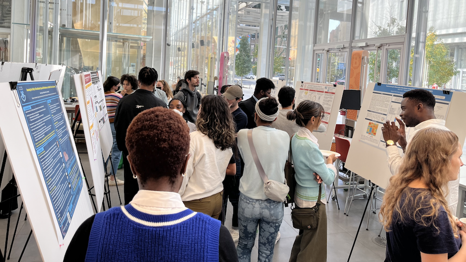 Participants in the Black Undergraduate Mentorship Program in the Biological Sciences (BUMP) share posters about their research at BUMP's first annual research symposium, held in the Education Lab at the Zuckerman Institute. (Photo credit: Ivan Amato/Zuckerman Institute) Participants in the Black Undergraduate Mentorship Program in the Biological Sciences (BUMP) share posters about their research at BUMP's first annual research symposium, held in the Education Lab at the Zuckerman Institute. Photo credit: Ivan Amato/Zuckerman Institute