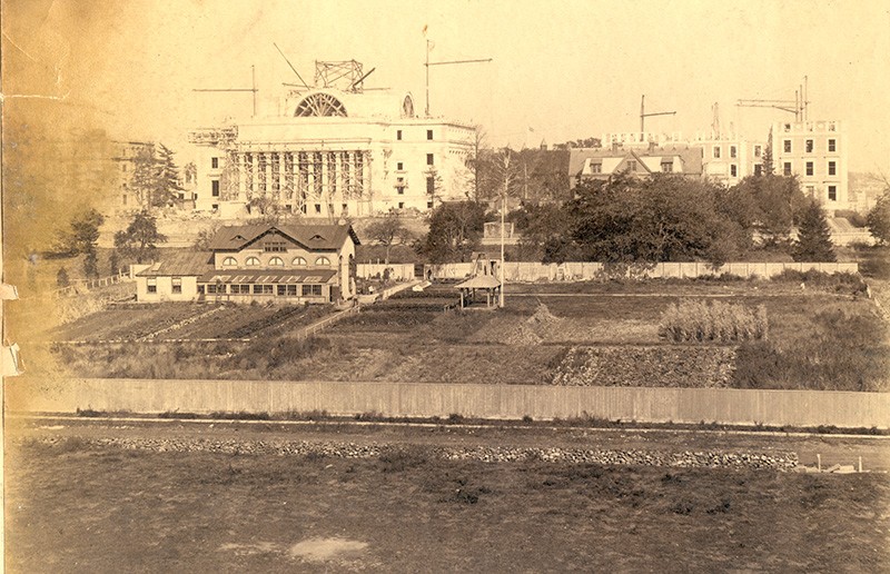 sepia toned image of the low plaza area vintage picture showcasing the small buildings surrounding the low library with grassy farmlike land