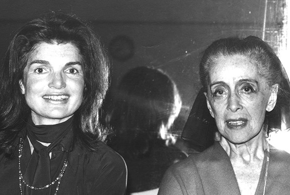 Two women posing facing the camera