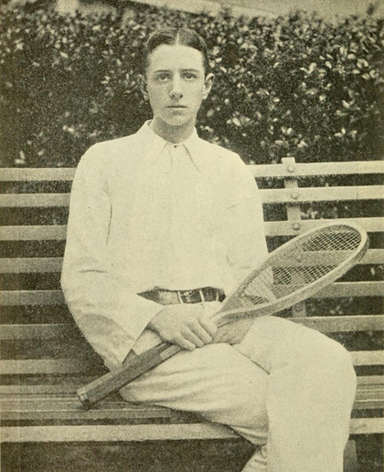 Robert Leroy holding a tennis racket. 