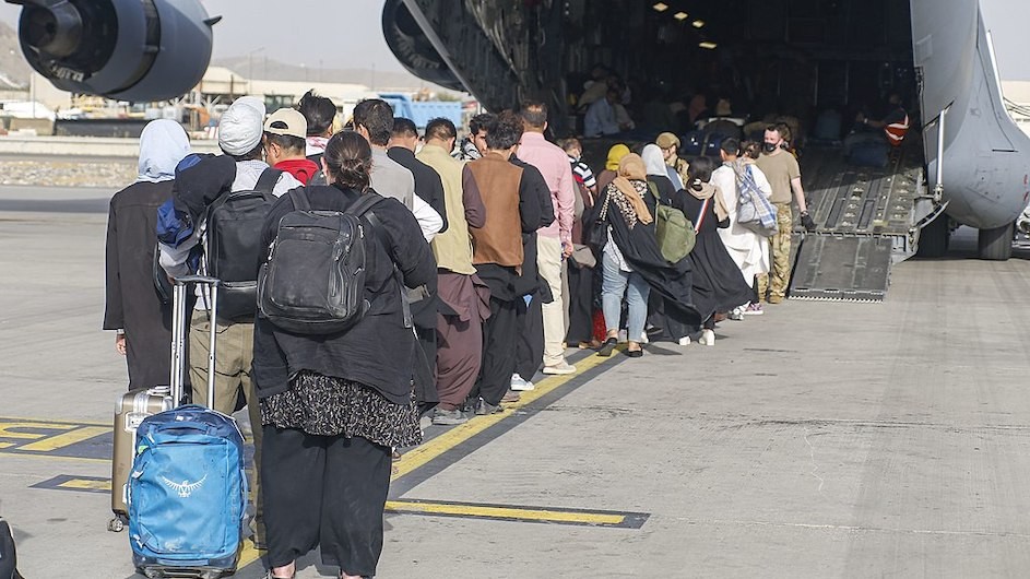 People in Afghanistan boarding emergency flights out of the country in August 2021.