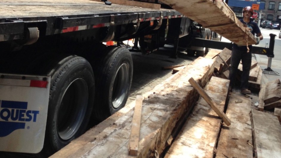 Here, joists are carted away from the 2018 demolition of a circa 1890s warehouse in Manhattan’s Tribeca neighborhood. (Alan Solomon) Timbers extracted from old buildings in NYC to capture historical climate data
