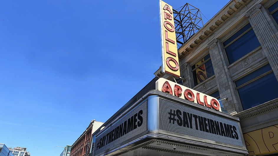 A sign on the historic Apollo Theater reads "#SAYTHEIRNAMES"