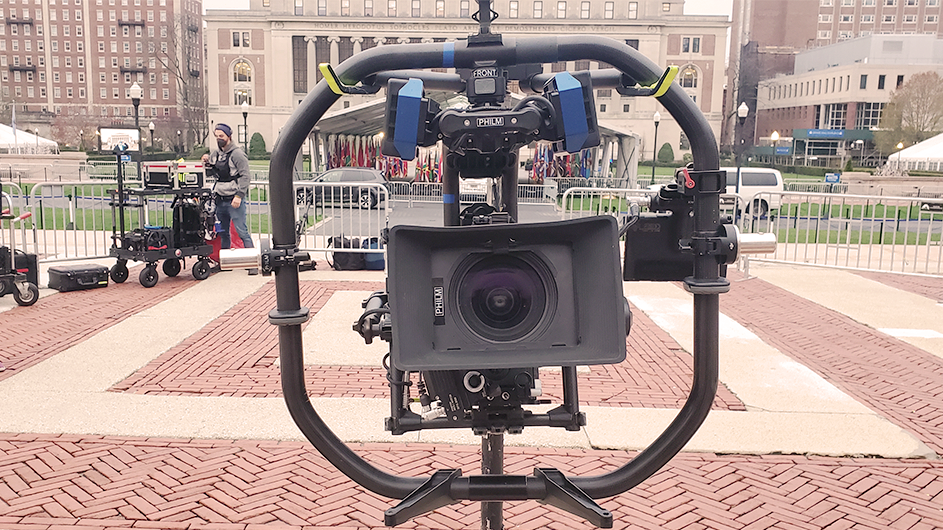 A close-up of a high-end camera in front of Butler Library. 