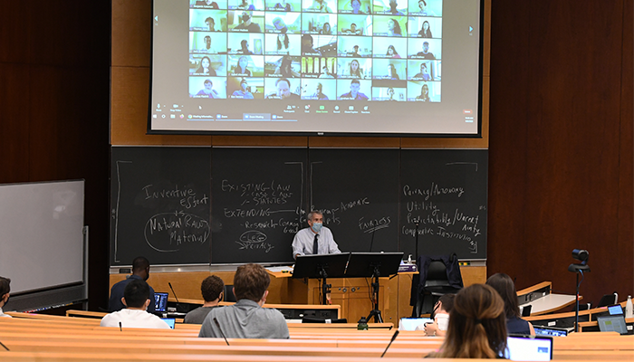 A Columbia Law professor teaches in person students and students on Zoom. 