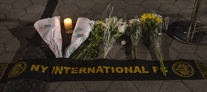 Photo by Lynn Saville. Flowers and a scarf from Davide Giri's soccer league