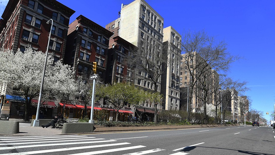 An empty street, void of cars and people, in upper Manhattan.