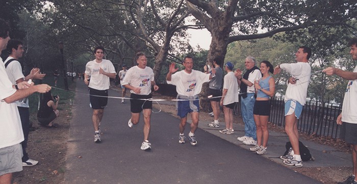 President Bollinger and others race to make it to the finish line of the Fun Run