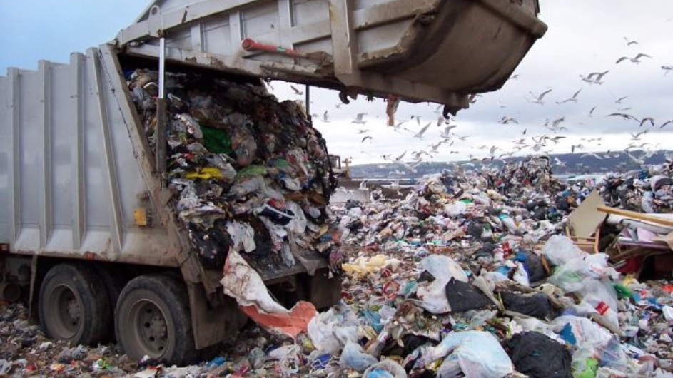 garbage truck off-loading trash into a landfill (Photo: St. Louis County, Minn.)