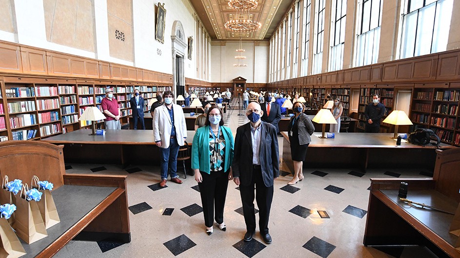 Ann Thornton and Ira Katznelson lead a group of Libraries workers in Butler Library. 