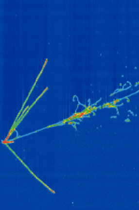 A collision between a neutrino and liquid argon created the red and green trails of charged particles seen here. Neutrinos can't be observed directly.