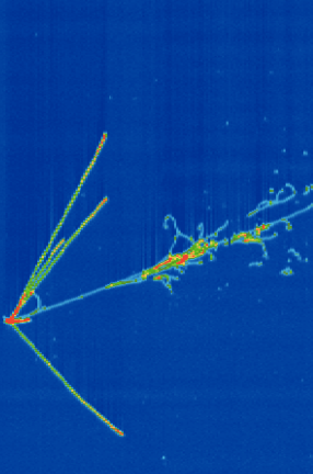 Neutrinos can’t be observed directly—only through their interactions with other particles. Here, a neutrino-liquid argon collision created the trails of green and red charged particles seen here. The straight trails were likely left by protons knocked out of an argon nucleus, while the scattered trail was probably left by electrons formed when an electron-neutrino hit an argon nucleus. (Image: MicroBooNE Collaboration, Fermilab) A collision between a neutrino and liquid argon created the red and green trails of charged particles seen here. Neutrinos can't be observed directly.