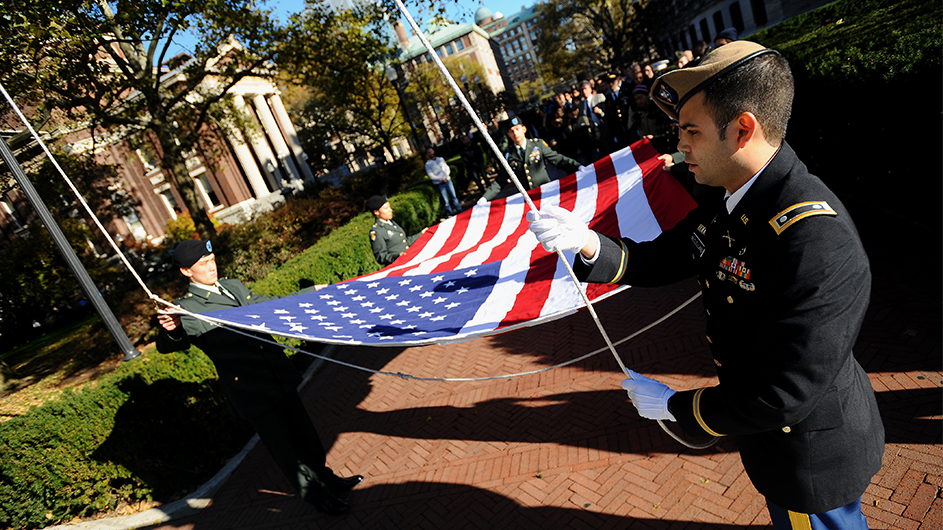 Photo by Eileen Barroso. The American flag is raised on Columbia's campus on Veterans Day in 2011.