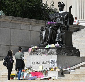 The 2020 pop-up Ruth Bader Ginsburg memorial in front of "Alma Mater." Photo by Eileen Barroso. Alma Mater, Columbia University