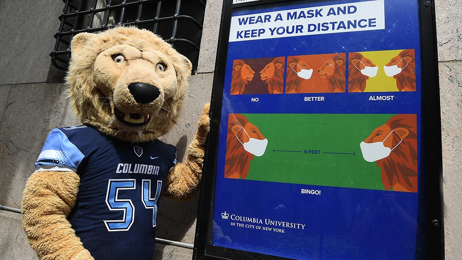 Photo by Eileen Barroso Roaree, Columbia's mascot, poses by a "Stay Healthy" campaign.