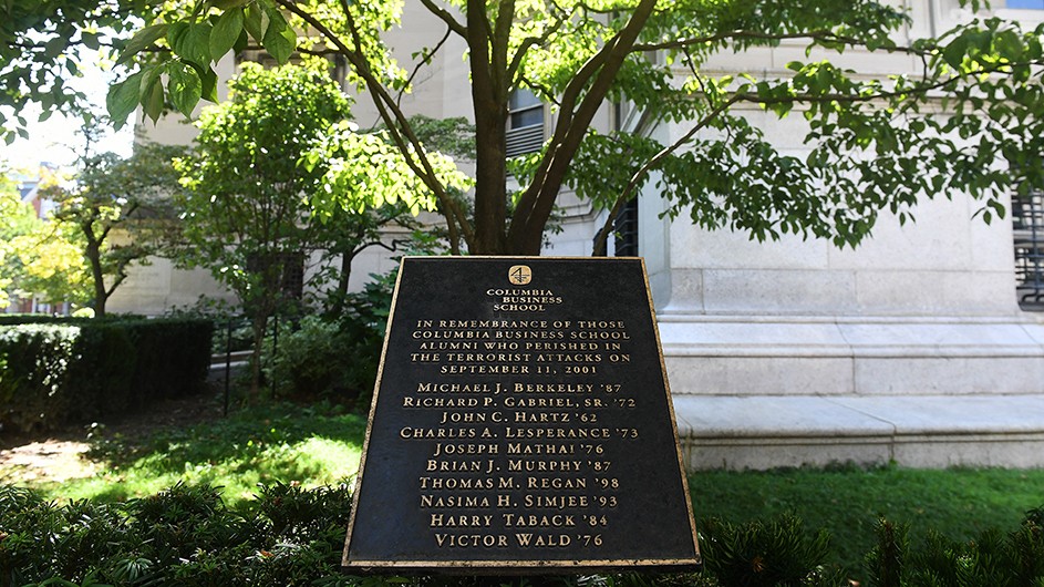 A sole plaque sits on the northeast corner of Low Library with the names of ten Columbia Business School alumni who were lost in the September 11 attacks. Photo by Eileen Barroso. A black plaque sits under a tree next to Low Library with the names of September 11 victims.
