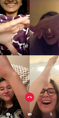 Solomia Dzhaman and her best friends on a FaceTime call making a heart shape with their hands.