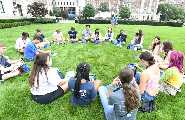 Students gather in a circle on South Lawn. 