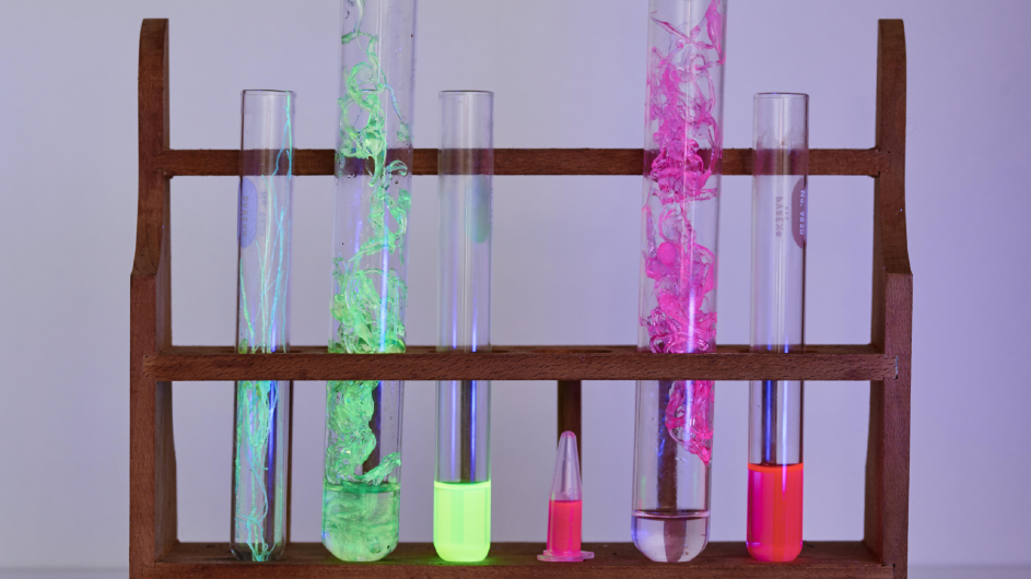 test tubes with biodegradable, naturally fluorescent fibers made with engineered proteins