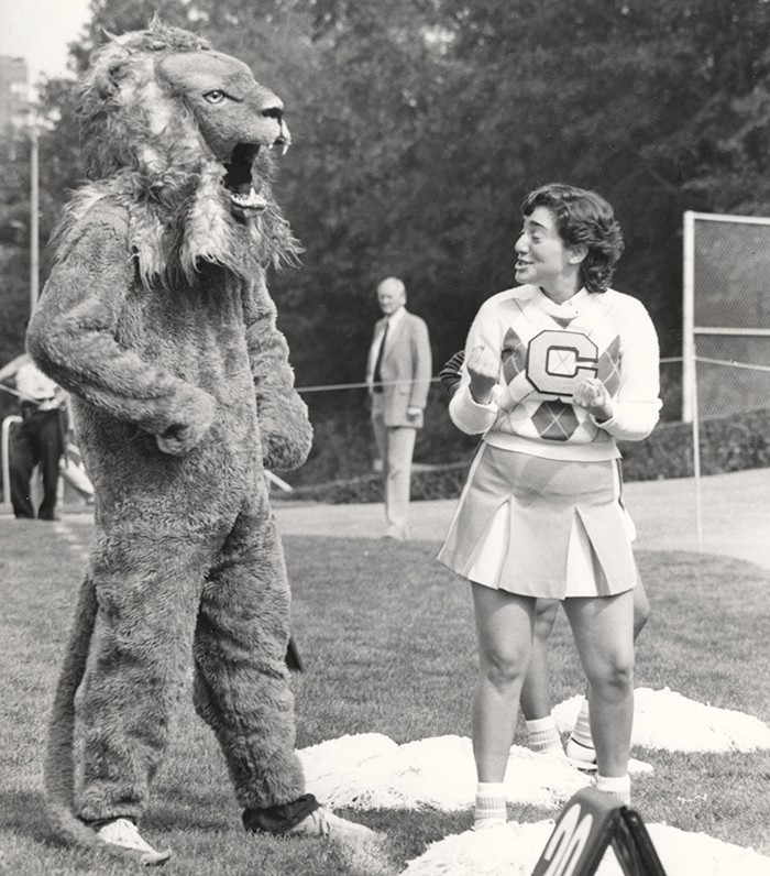 The Columbia Lion mascot talks with a cheerleader