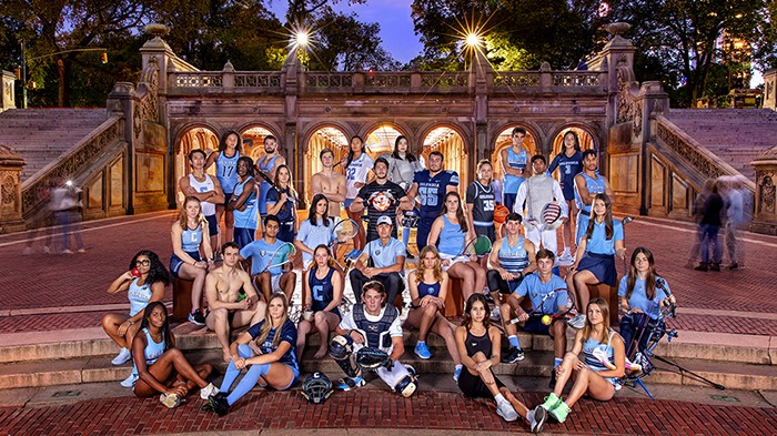 Representatives from 31 of Columbia's sports teams pose at Bethesda Fountain in Central Park.