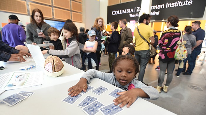 A child plays with cards at the Zuckerman Institute. 