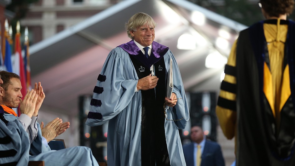 Photo: Bruce Gilbert. President Bollinger walking up to the podium to deliver a speech at Columbia's 2022 Convocation.