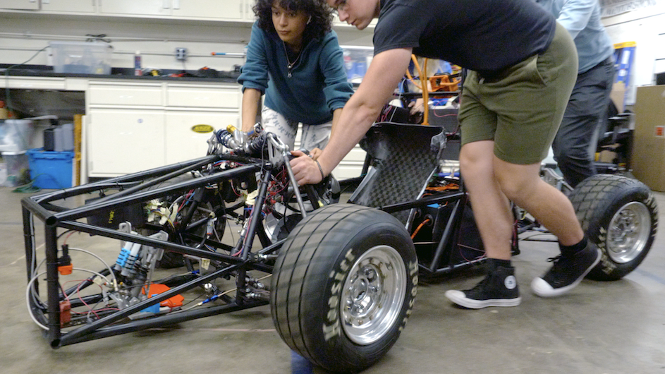 Two students from Columbia University Formula Racing Team working on the university's first electric race car.