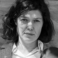 Yevgenia Belorusets Black and white photo of a woman with medium-length dark hair.