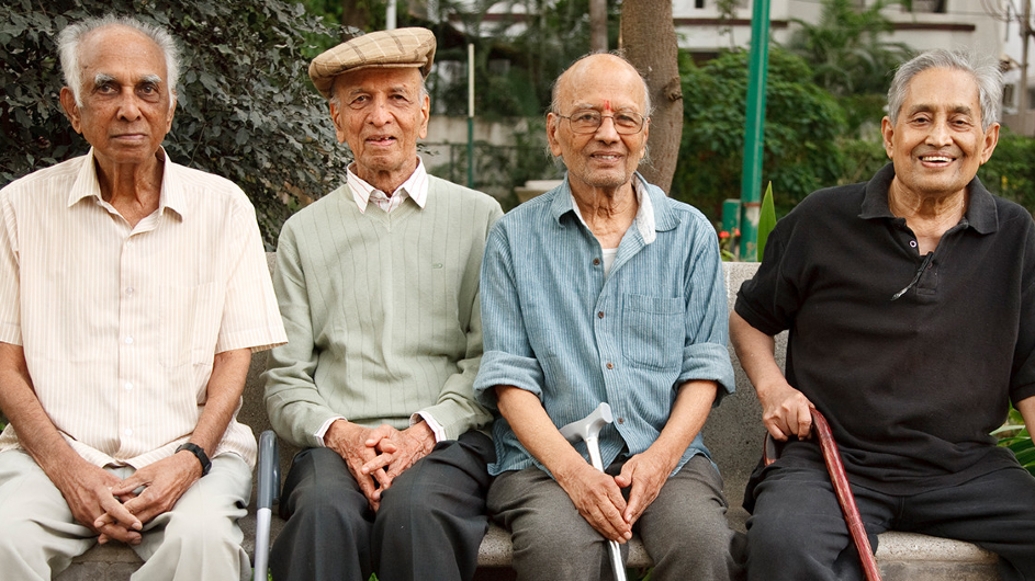 older people sitting on a bench