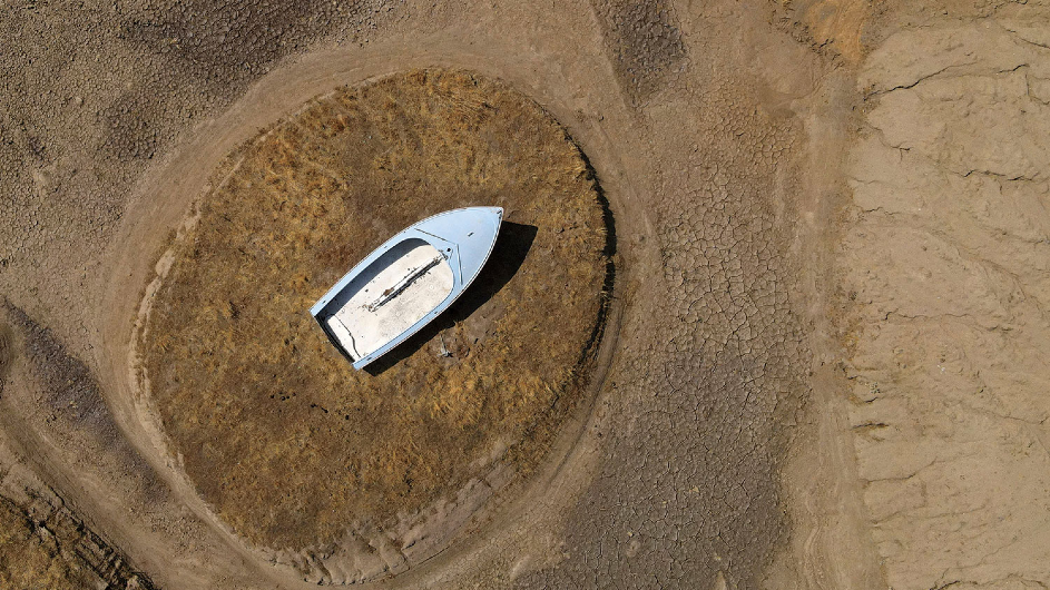 stranded boat on a dried-out lake bed