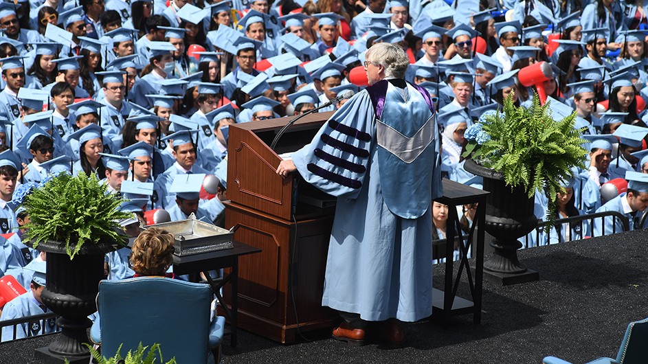 President Bollinger addresses tens of thousands of guests and graduating Columbia students in light blue caps and gowns. 