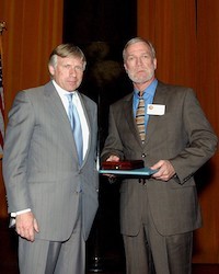 Columbia University President Lee C. Bollinger presents Walter Robinson of The Boston Globe with the 2003 Pulitzer Prize in Public Service. Photo credit: Eileen Barroso