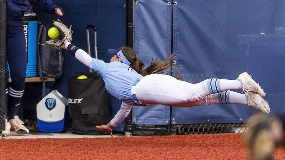 Columbia University infielder Bubba Gleaves dives for a ball in softball game against Yale