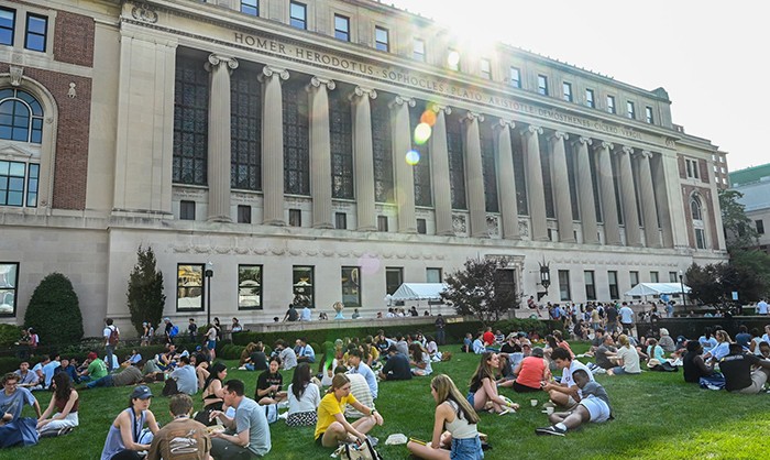 Orientation season would not be complete without some time spent on Butler Lawn on a sunny day with a meal provided by Columbia Dining. Photo by Diane Bondareff/Columbia Dining. Butler Lawn teems with students on a sunny day.
